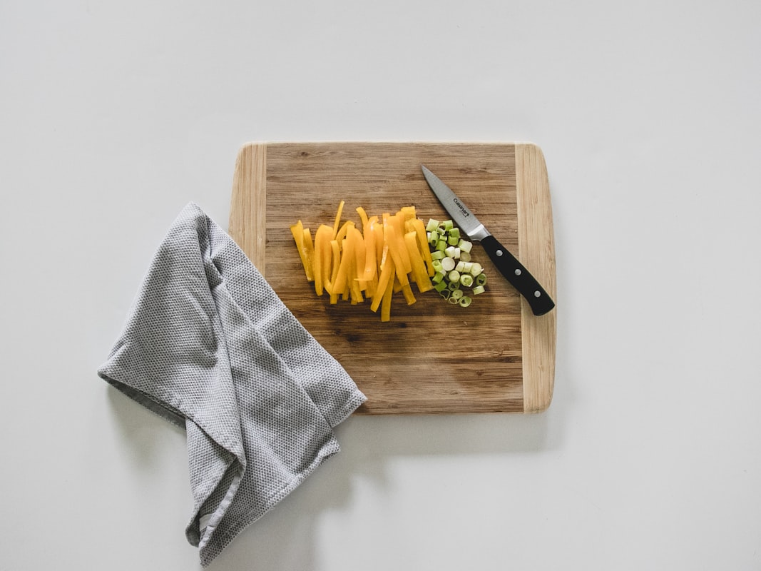 Hands preparing ingredients in a modern kitchen