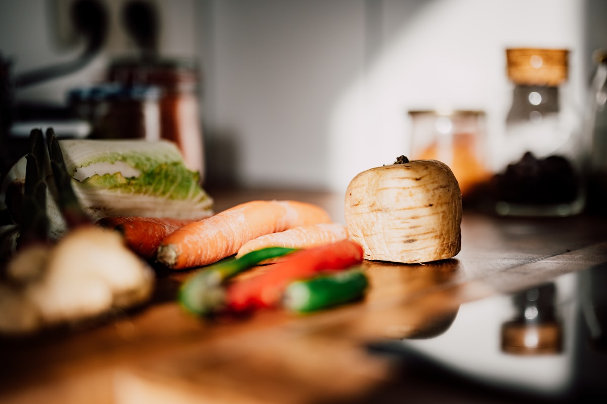 Cooking tools and ingredients on a wooden surface